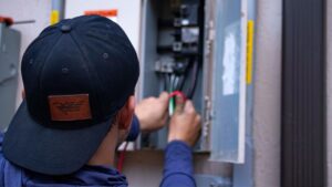 HVAC technician performing a service check on residential equipment